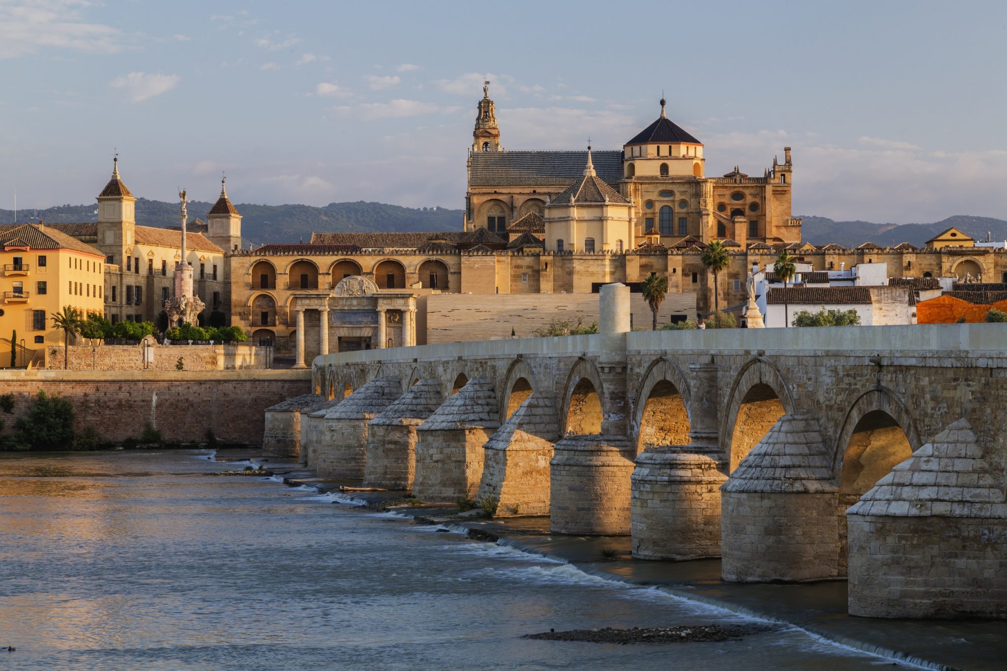 Arches of urban bridge in Cordoba cityscape, Andalusia, Spain